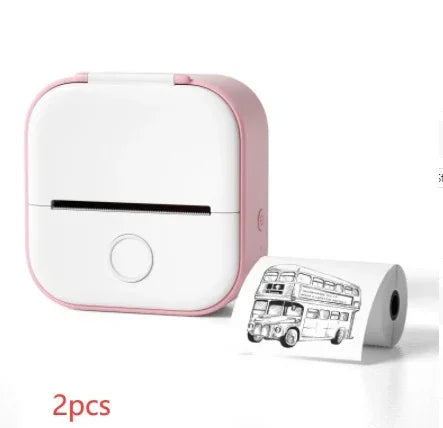 Compact pink and white portable thermal printer with printed bus illustration and extra paper roll