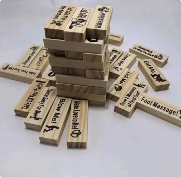 Adult party game with stacked natural wood blocks, featuring playful engraved text.
