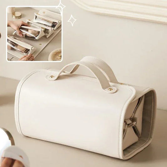Beige faux leather handbag with structured shape and top handles, minimalist style