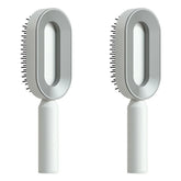 Modern grey and white oval hair brushes with ergonomic handles and sleek design