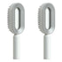Modern grey and white oval hair brushes with ergonomic handles and sleek design