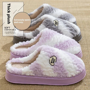 Plush slip-on slippers in pastel purple and gray, thick fleece material, cozy fit.