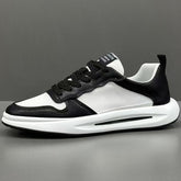 Black and white low top sneaker with mesh and leather material, chunky sole, modern fit