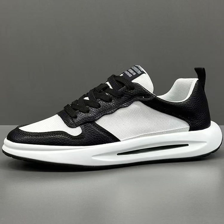 Black and white low top sneaker with mesh and leather material, chunky sole, modern fit