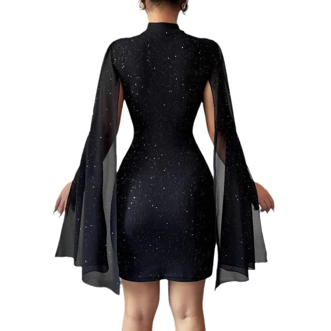 Black bodycon mini dress with shimmering specks and sheer long cape sleeves