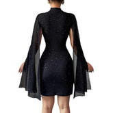 Black bodycon mini dress with shimmering specks and sheer long cape sleeves