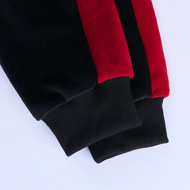 Close-up of black and red streetwear jacket sleeves with ribbed cuffs and soft fabric