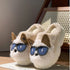 Beige plush slippers with faux fur, dog face, 3D ears, and blue novelty sunglasses design