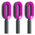 Set of three futuristic hair brushes with pink oval heads and black handles
