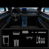 Futuristic car interior with black panels, blue LED trim, and dashboard accent details