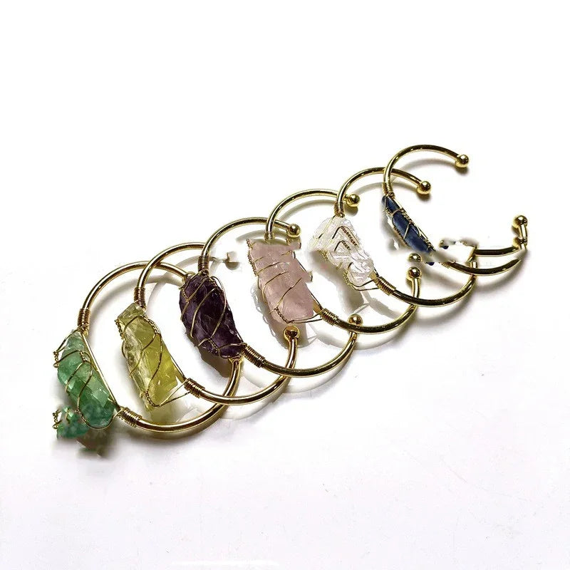 Gold wire bracelets featuring raw multicolor crystal stones, trendy minimalist jewelry.