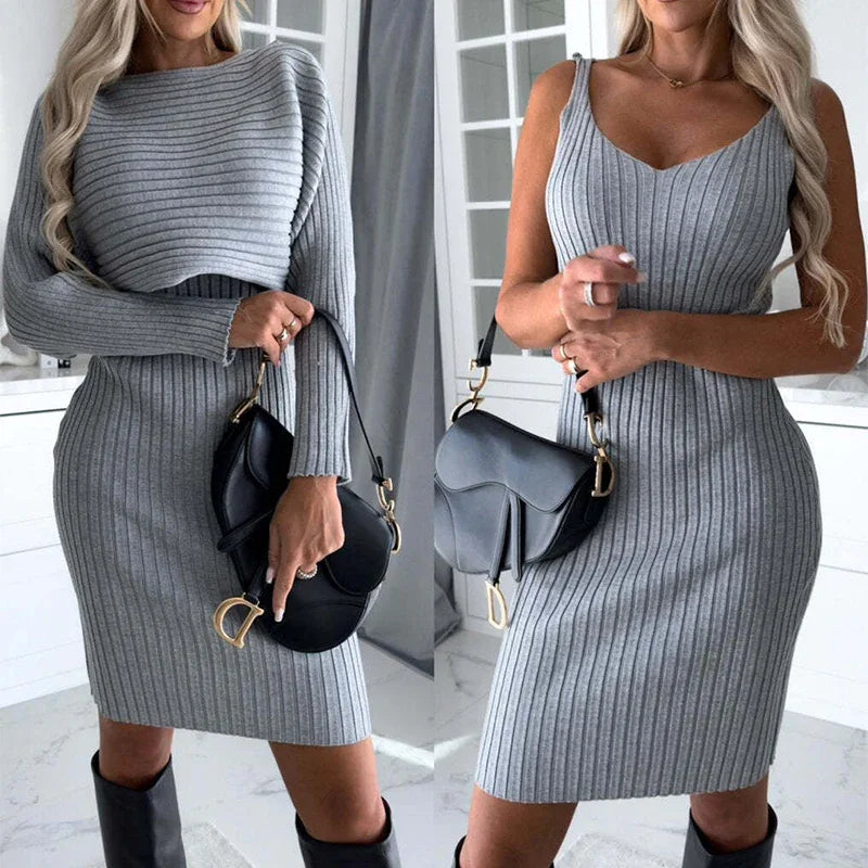 Woman in fitted gray ribbed knit dress with long sleeves and sleeveless options, accessorized with black bag.