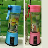 Blue and pink portable electric blenders with transparent cups and fruit print design