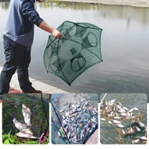 Person in relaxed fit, dark-colored streetwear using mesh fishing net trap by a pond.