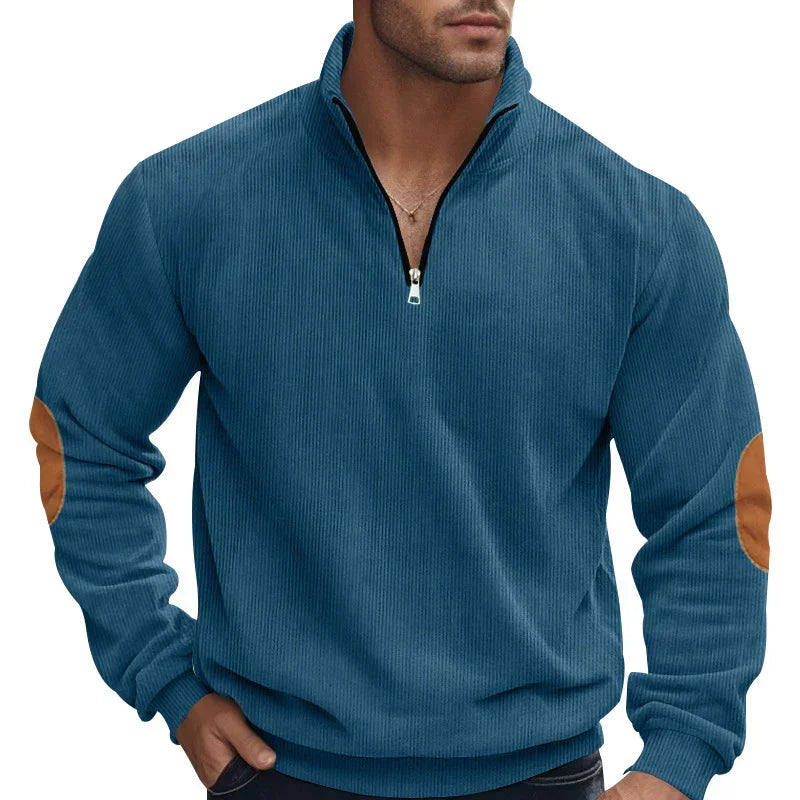 Men's blue ribbed pullover with half zip, brown elbow patches, relaxed fit streetwear