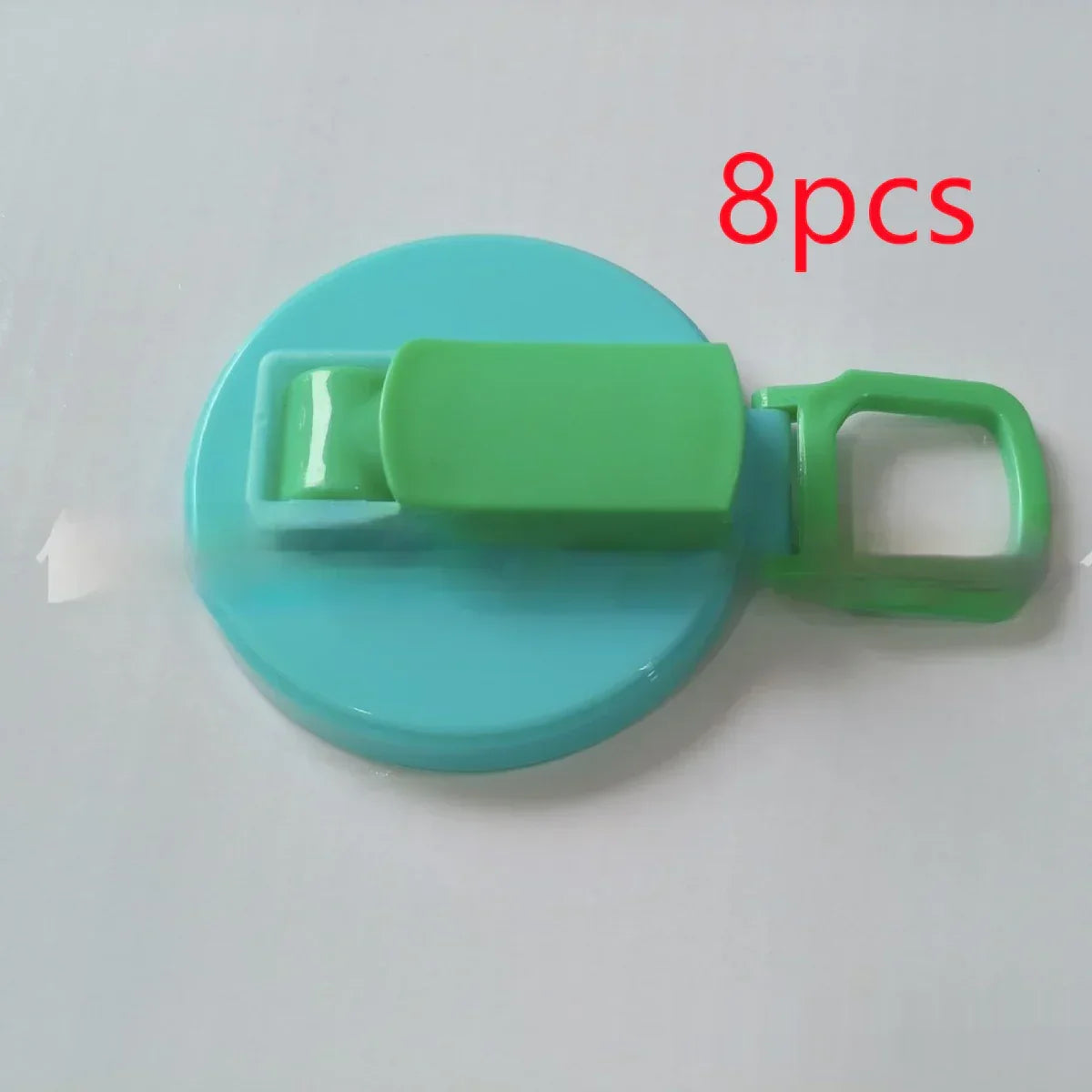 Blue and green round plastic clip with handle, 8 pieces, on white background