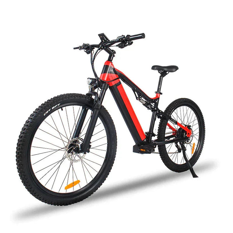 Black and red electric mountain bike with thick tires and front suspension on white background.