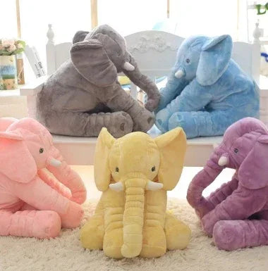 Plush elephant toys in pastel pink, yellow, gray, blue, and purple, soft fabric, cuddly style