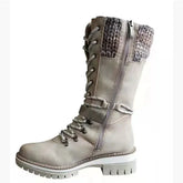 Beige lace-up knee-high boot with chunky sole, knit cuff, side zipper, and faux leather material