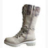 Beige lace-up knee-high boot with chunky sole, knit cuff, side zipper, and faux leather material