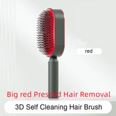 Red and black self-cleaning hair brush with ergonomic handle and dense bristles