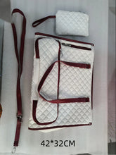 Quilted white and red travel bag set with adjustable straps and zippered pouches, 42x32 cm
