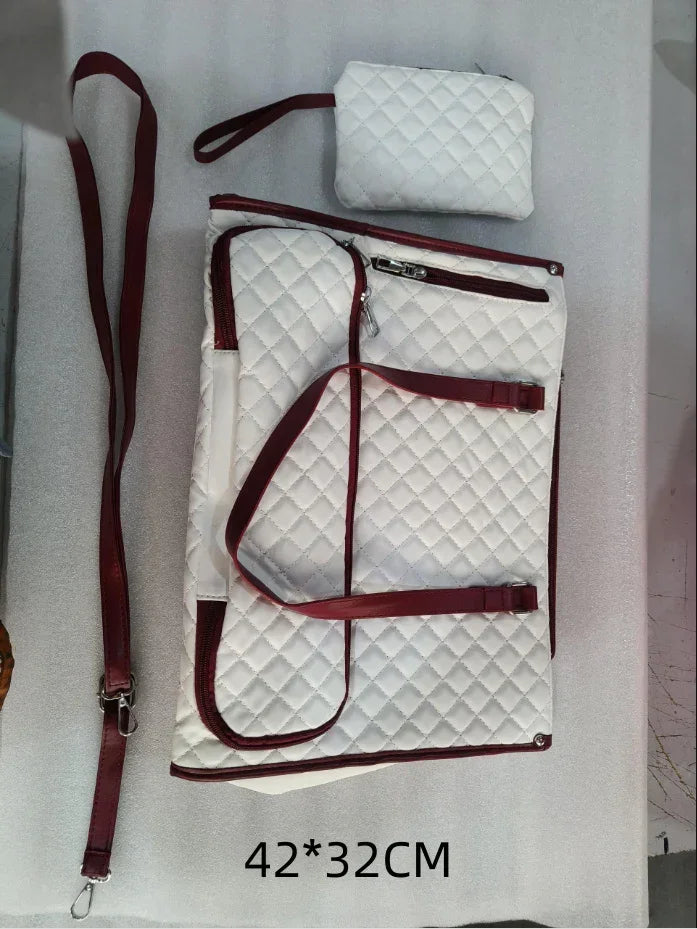 Quilted white and red travel bag set with adjustable straps and zippered pouches, 42x32 cm