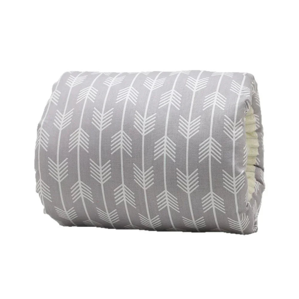 Gray cotton quilt with white arrow pattern, soft material, rolled and lightweight.