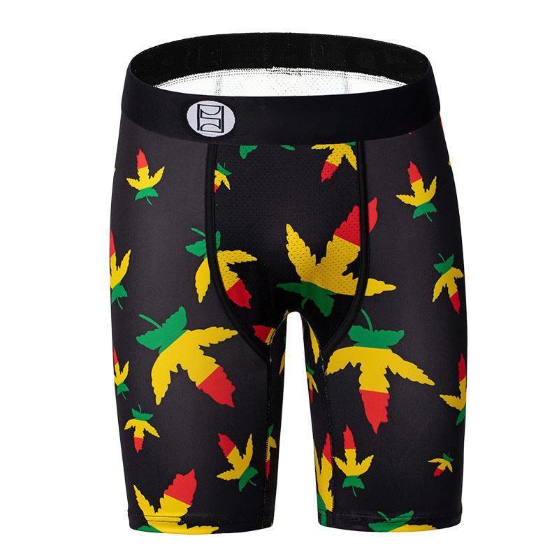 Black compression shorts with colorful red, yellow, and green leaf print, slim fit