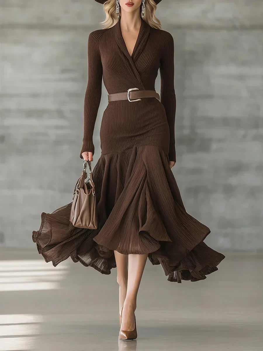 Elegant brown ribbed knit dress with long sleeves, flared skirt, fitted waist, and flowy hem.