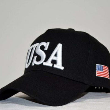 Black cotton baseball cap with white USA embroidery and small American flag patch, curved brim
