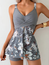 Gray floral sleeveless swim dress with fitted bodice and flared skirt, soft stretch fabric