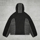 Black and gray sherpa fleece hoodie with color block panels and relaxed streetwear fit