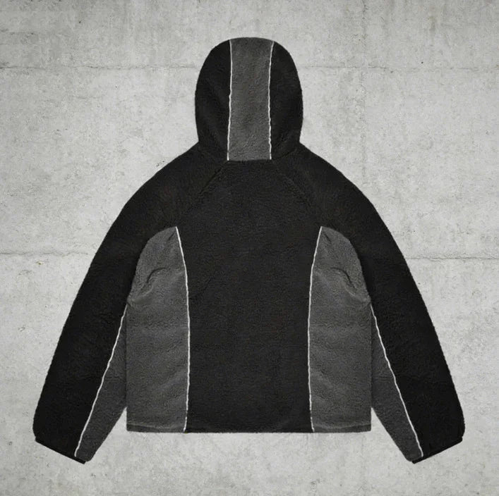 Black and gray sherpa fleece hoodie with color block panels and relaxed streetwear fit