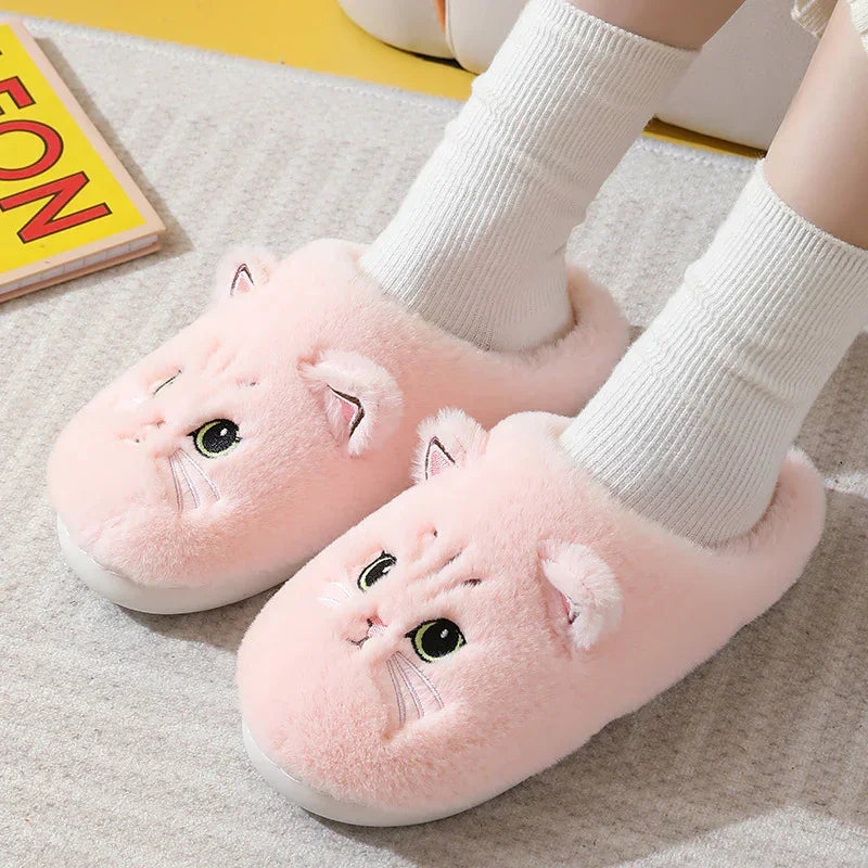 Plush pink cat slippers, fuzzy material, closed-toe, cozy fit with white socks