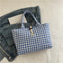 Blue and white gingham tote bag with rope detail, casual fit, cotton material, on denim jacket