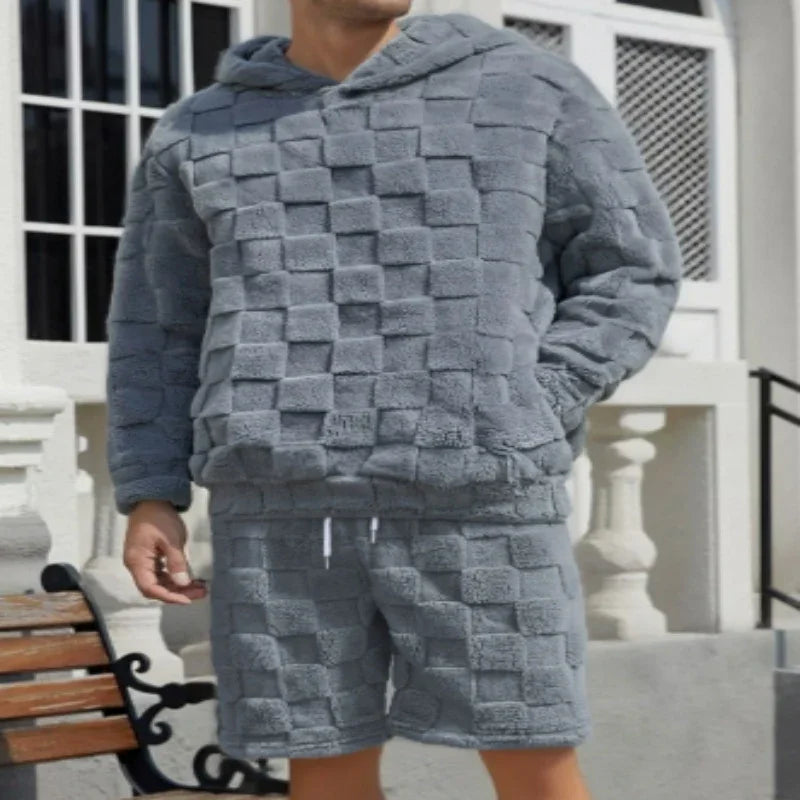 Man wearing grey textured fleece hoodie and shorts set, relaxed fit streetwear