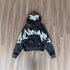 Black oversized zip-up hoodie with bold white graffiti print and relaxed fit, cotton blend
