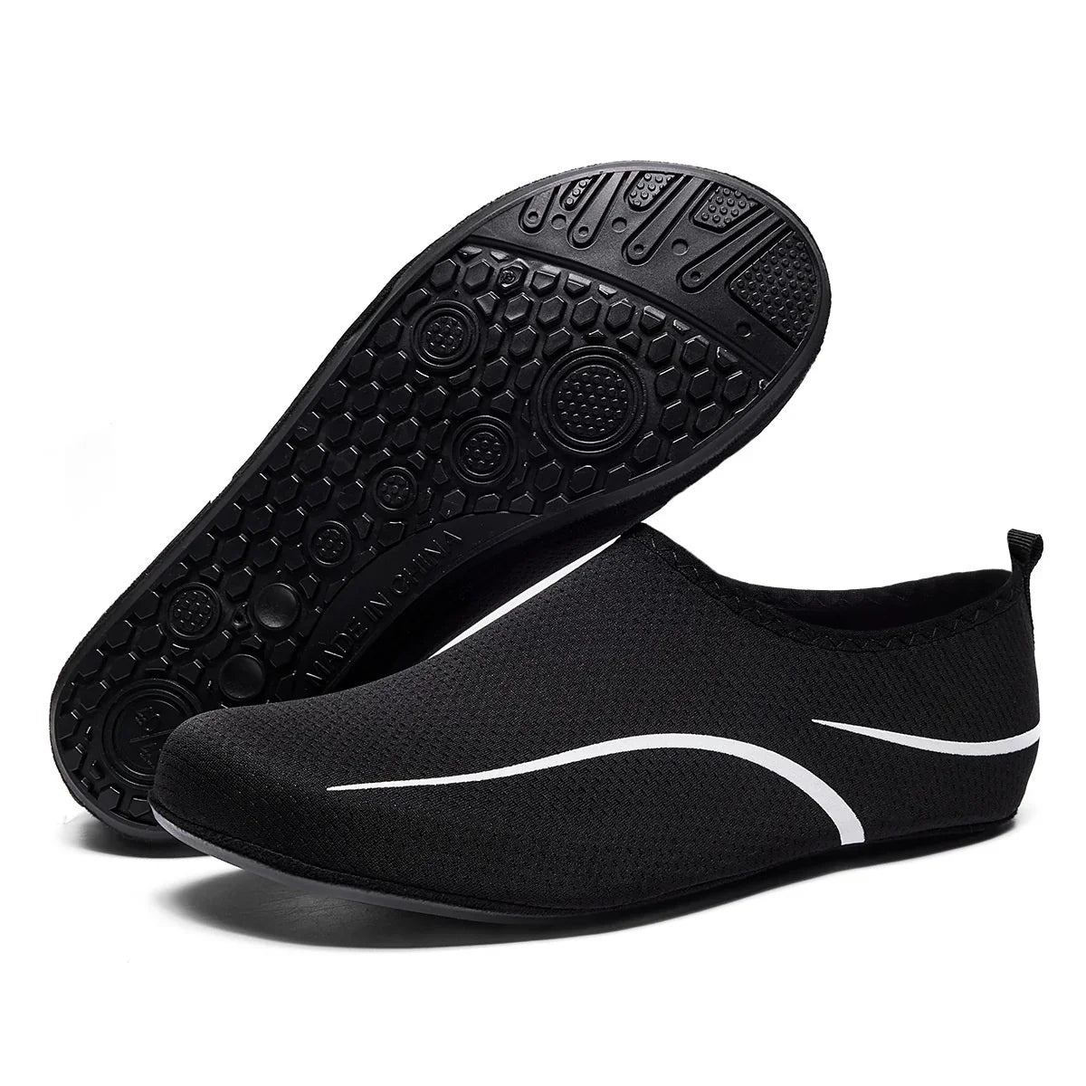 Black slip-on mesh sneakers with white wave accents and flexible rubber sole