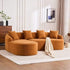 Curved orange boucle sectional sofa with four matching cushions on a beige area rug in a modern living room.