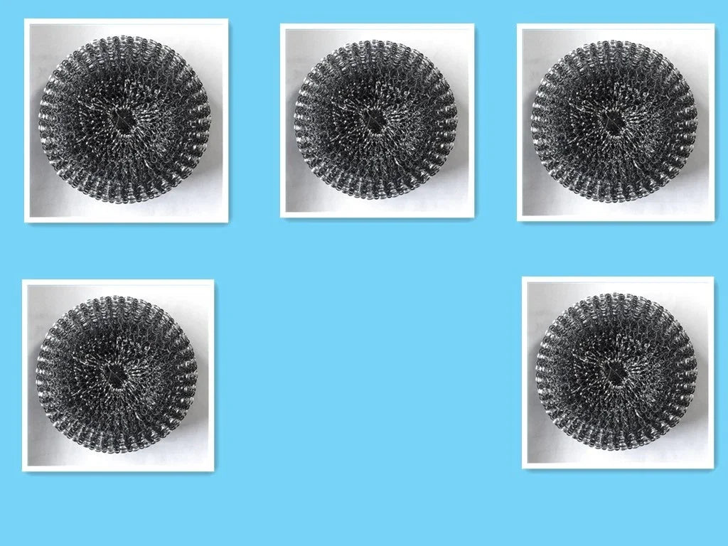 Five metallic circular scrubbers with a textured, coiled design on a blue background