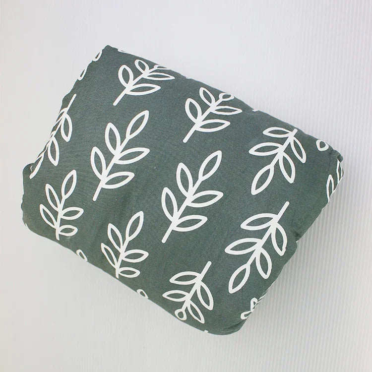 Green pillow with white leaf print, cotton fabric, modern minimalist style