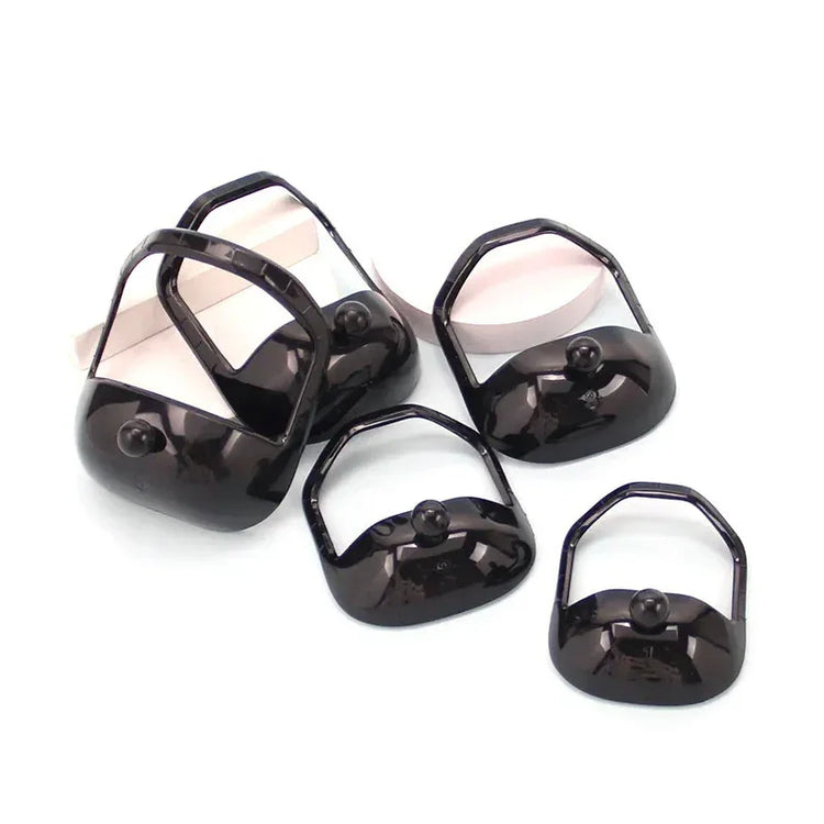 Set of black glossy plastic bag handles with simple modern design on white background