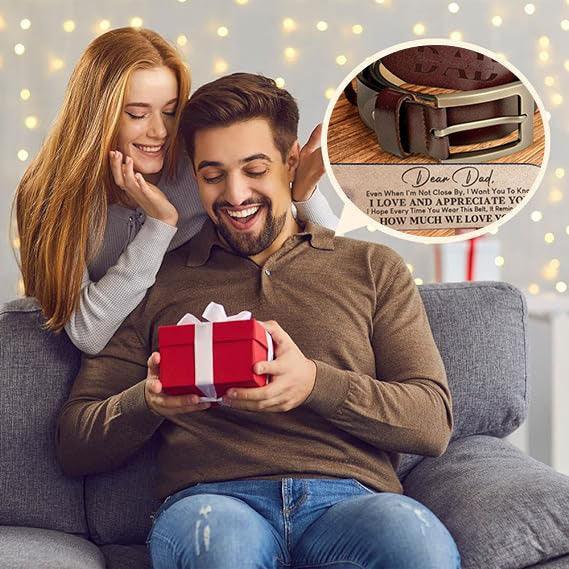 Man in a brown long sleeve polo shirt and blue jeans, receiving a gift box, with a close-up of a leather belt and metal buckle inset.
