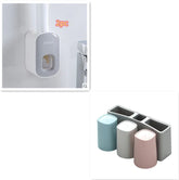 Wall-mounted toothbrush holder with toothpaste dispenser and set of pastel toothbrush cups