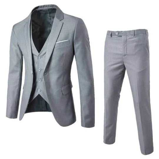 Slim fit light gray three-piece suit with blazer, vest, and pants, modern formal style