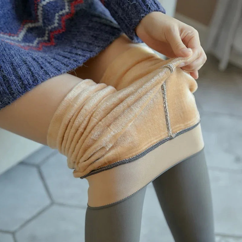 Woman wearing thick fleece-lined beige thermal tights with a slim fit and cozy knit texture