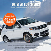 White SUV with snow chains on tires driving on snowy road, low speed safety tip, winter setting.