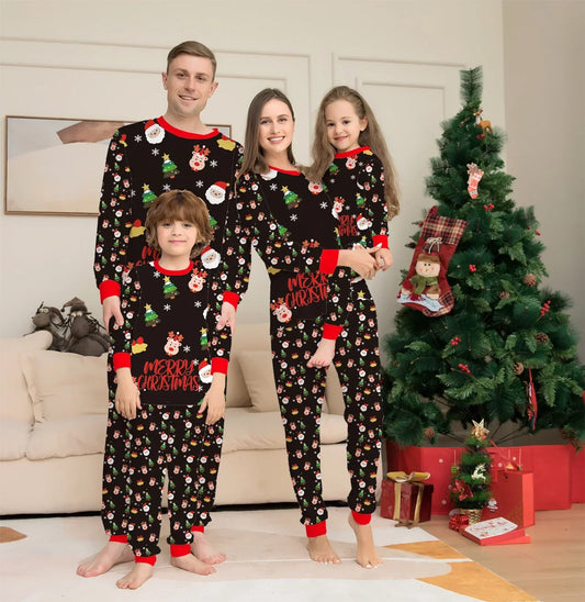 Family in matching black Christmas pajamas with colorful holiday prints, relaxed fit, next to a decorated Christmas tree.