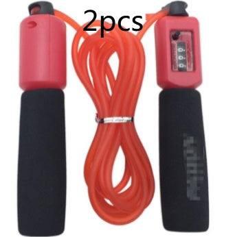 Red jump rope with black foam handles, digital counter, fitness accessory